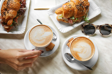 Poster - Woman eating lunch in modern cafe