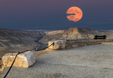 Rising Of Supermoon Above Mountains In Desert Of The The Negev, Israel, November 14, 2016