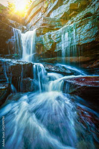Tropical waterfall with sun rays © Dmitry Rukhlenko