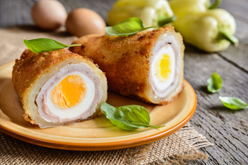 Wall Mural - Fried pepper stuffed with pork cutlet, ham, cheese and egg