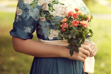 Woman Holding A Bouquet Of Summer In The Park, Floral Dress, Wit