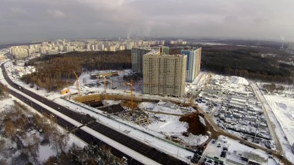 Wall Mural - Construction site in the city aerial view at winter