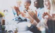 Photo of partners clapping hands after business seminar. Professional education, work meeting, presentation or coaching concept.Horizontal,blurred background.