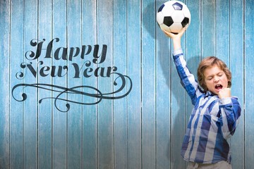 Wall Mural - Composite image of child with soccer ball