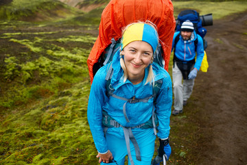 Wall Mural - hikers on the trail in the Islandic mountains. Trek in National Park Landmannalaugar, Iceland