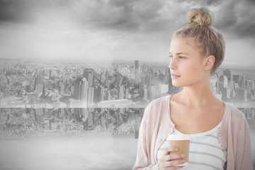 Poster - Composite image of woman holding coffee cup 