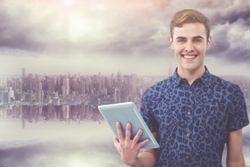 Poster - Composite image of handsome man with tablet