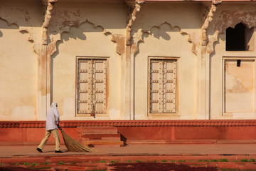 Wall Mural - Worker sweeping in Anguri Bagh (Grape Garden) in Agra Fort, Utta