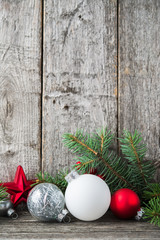Wall Mural - red, silver and white xmas ornaments on rustic wood background. merry christmas card. winter holiday