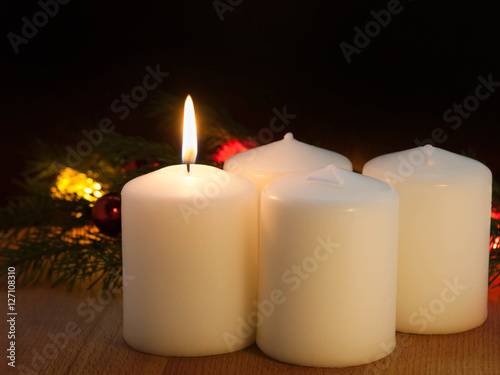 Christmas Candles And Lights First Sunday Of The Advent Prophecy Candle On A Dark Background Buy This Stock Photo And Explore Similar Images At Adobe Stock Adobe Stock