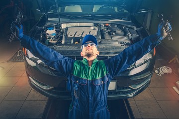 Wall Mural - Car Fixing Moment of Triumph