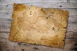 Fototapeta Mapy - treasure map on wooden table