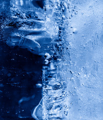 Micro air bubbles in the ice frozen during their movement to the water surface. 1 : 1 macro lens shot