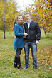 © 060808 - Man and woman are embracing each other and smiling, full length, autumn, nature.