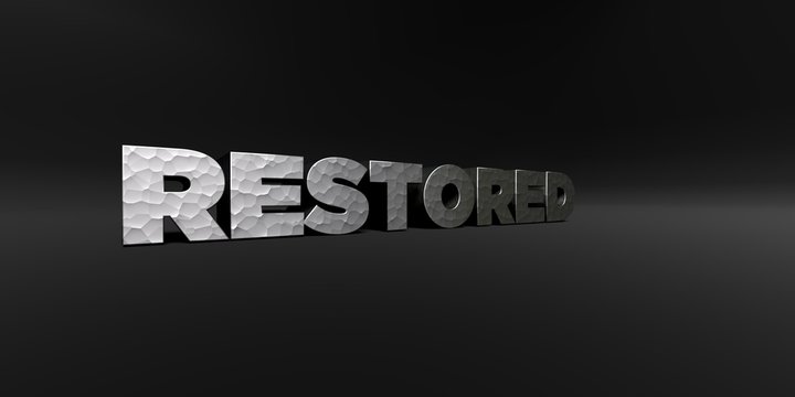 RESTORED - hammered metal finish text on black studio - 3D rendered royalty free stock photo. This image can be used for an online website banner ad or a print postcard.