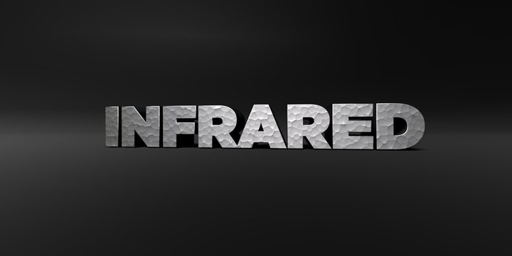 INFRARED - hammered metal finish text on black studio - 3D rendered royalty free stock photo. This image can be used for an online website banner ad or a print postcard.