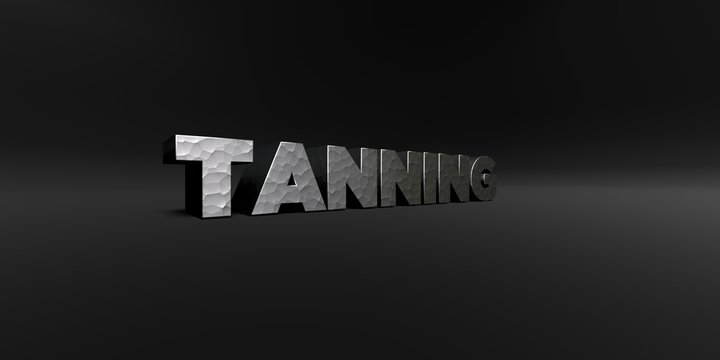 TANNING - hammered metal finish text on black studio - 3D rendered royalty free stock photo. This image can be used for an online website banner ad or a print postcard.