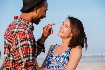 Wall Mural - Couple laughing and having fun outdoors