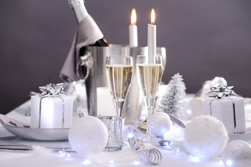 Wall Mural - bright white and silver new year eve or christmas table in a luxury restaurant with champagne