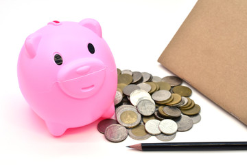 Pink piggy bank and Stacks of money coins isolated over the white background