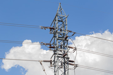 high voltage electricity post or high-power tower against sky background