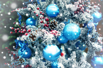 Wall Mural - Decorated Christmas tree, closeup. Snowy effect. Christmas celebration concept.