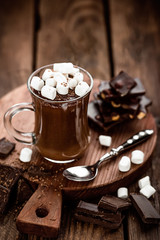 Wall Mural - hot chocolate dessert with marshmallows on wooden background