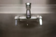 Dripping faucet with shallow depth of field