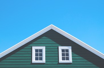 Green house and white roof with blue sky in sunny day