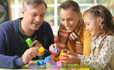 Canvas Print - Father with kids play