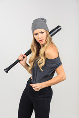 Cool hot fashionable woman bandit dressed in hat with baseball b