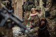 Soldier and children on battlefield background.