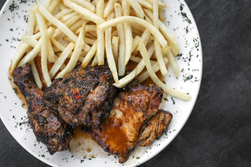 Wall Mural - portuguese famous piri piri spicy bbq chicken with french fries