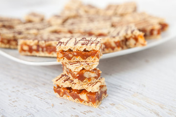 Wall Mural - Crisp waffle wafer biscuits with caramel and walnut