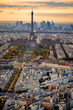 Aerial Paris view in late autumn from Montparnasse Tower at sunset. Eiffel Tower in the distance and financial district.