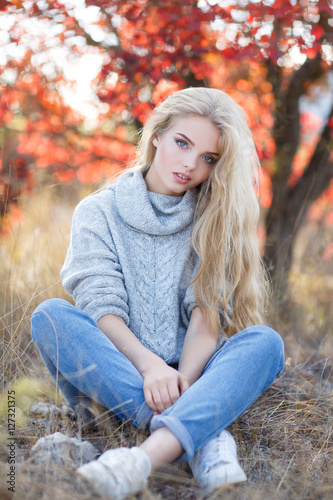 Autumn Portrait Of Beautiful Young Woman With Long Blond Hair And