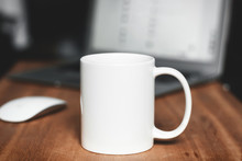 White Mug On The Desktop