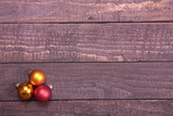 Fototapeta Tulipany - Three Christmas Balls isolated over wooden background