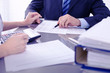 © rogerphoto - Bookkeepers or financial inspector making report, calculating or checking balance. Audit concept.
