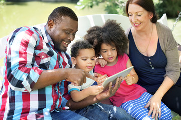 Wall Mural - Family Relax Happiness Using Tablet Concept