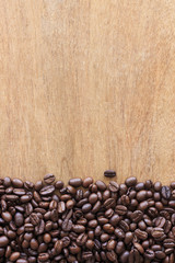 coffee beans on grain wooden table background 