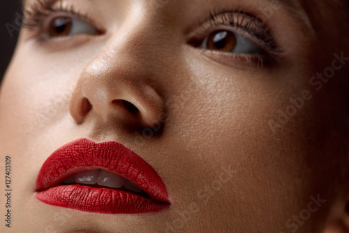 Close-up Of Beauty Woman Face With Beautiful Makeup And Red Lips Plakat