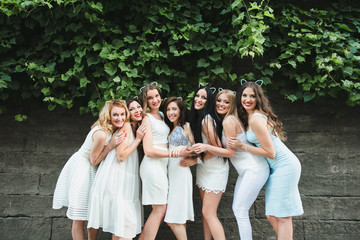 Wall Mural - The future bride with girls stand near trees