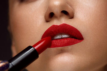 Red Lipstick. Closeup Of Woman Face With Bright Lips Makeup