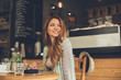 © djile - Beautiful young woman sitting in a cafe waiting her boyfriend