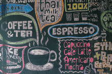 Sign Menu Coffee And Tea Drawn With Colored Chalks On A Black Blackboard