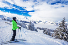 Young Woman Skiing In Kitzbühel Ski Resort In Tyrolian Alps, Austria