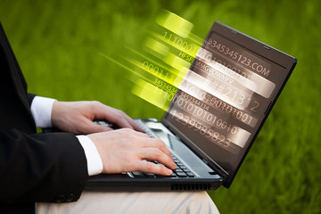 close up of man typing on laptop computer