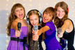 © Nichizhenova Elena - Group of happy girls singing on karaoke