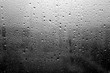 © pavelalexeev - Rain drops on window close-up in black and white